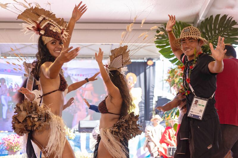 Paris 2024 Olympic Games: Rio Waida of Team Indonesia dances with local performers. Photograph: Ed Sloane/AFP/Getty Images