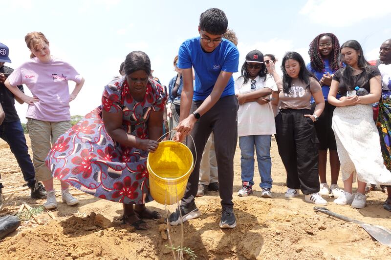 A tree is planted in Choongo village in Monze to mark the visit of BTYSTE science in development award winners