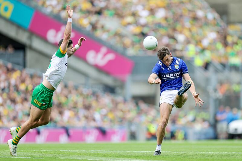 Kerry's David Clifford scores despite Brendan McCole of Donegal. Photograph: Laszlo Geczo/Inpho
