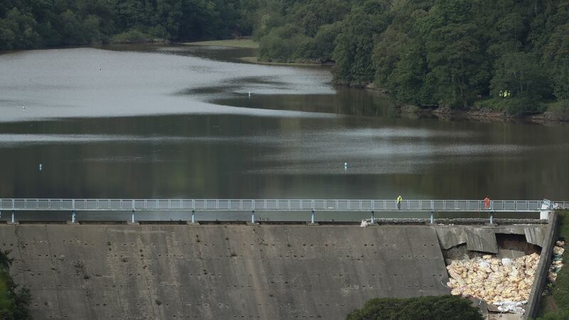 Workers make repairs to Toddbrook Reservoir near the village of Whaley Bridge in  Derbyshire, after it was damaged in heavy rainfall.  Photograph: Yui Mok/PA Wire