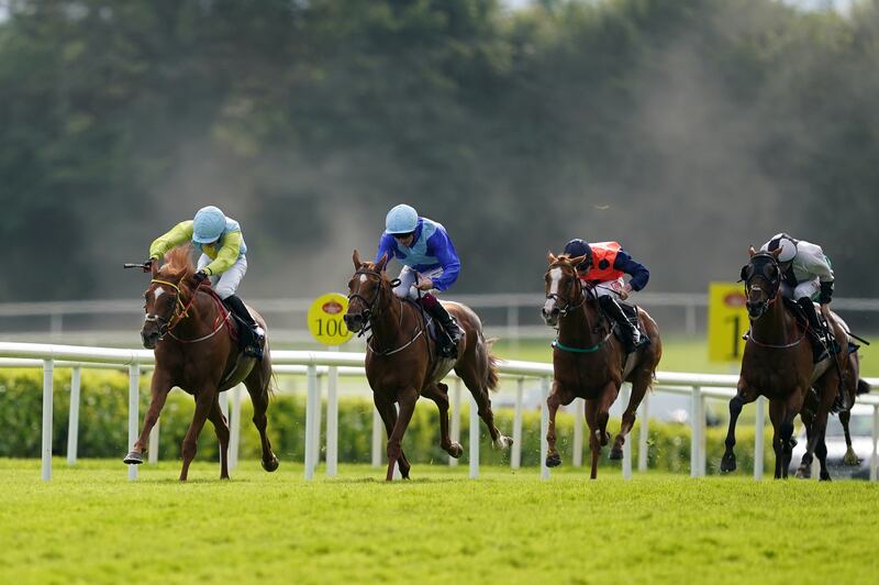 Hidden Land ridden by Jockey Luke McAteer (left) on their way to winning the Guinness 0.0 Handicap during day four of the Galway Races. Photograph: Brian Lawless/PA 