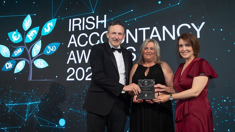 Danielle O'Callaghan, head of finance recruitment at ProSource Group, presents the employer of the year award to Michael Byrne and Claire Reilly, DBASS Accountancy & Tax Advisory