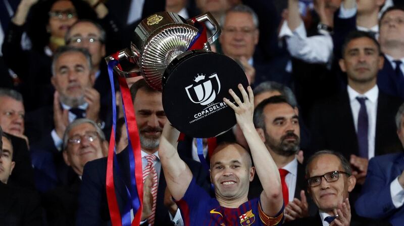 Barcelona captain Andres Iniesta  lifts the trophy  King  Felipe VI applauds. Photograph: Juan Medina/Reuters