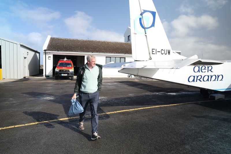 Fine Gael's Seán Kyne gets off an Aer Arann flight to Inis Oírr. Photograph: Enda O'Dowd