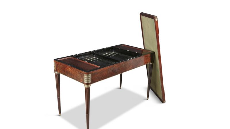 French mahogany and leather games and writing table with removable top, €1,500–€2,000 at Adam’s.