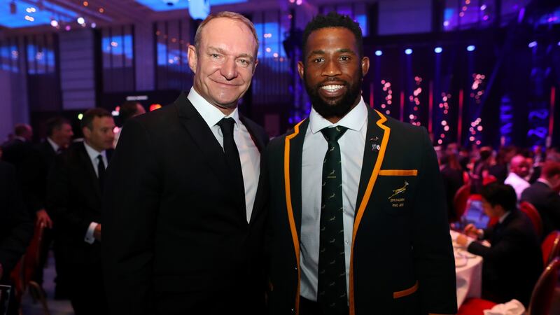 The  1995-winning South African captain Francois Pienaar congratulates current captain Siya Kolisi during the World Rugby Awards at the Prince Park Tower Hotel in Tokyo, Japan. Photograph: Dan Mullan  World Rugby/World Rugby via Getty Images