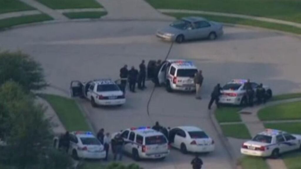 A still image taken from KPRC-TV aerial video footage shows police and a suspect in a standoff at a residential neighborhood following a shooting incident in Texas. Photograph: Reuters/KPRC-TV