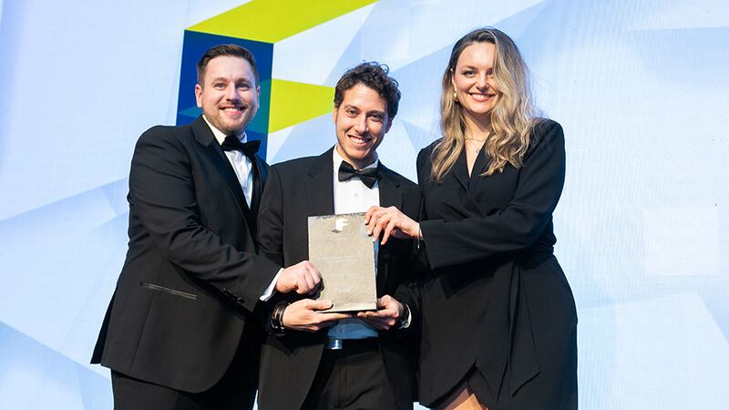 Juan Manuel Aragon Tellez, architect at Technical Consultancy Finsa, Finsa Ireland, presents the Fit Out Project of the Year - Hospitality (Hotel) award to Thomas Ferguson, Pure Fitout, and Marie Smyckova, O’Donnell O’Neill Design.