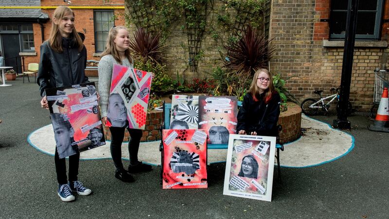 Kacper Jaroszynski (16), Roisin Cork (14) and Emma Barry (12) with their  projects on the imapact of ‘fake news’ on children at St Andrew’. Photograph: Brenda Fitzsimons