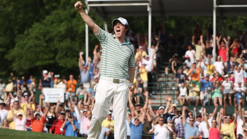 Rory McIlroy celebrates as he holes a birdie putt on the 18th green to secure victory at  the 2010 Quail Hollow Championship, his first win on the PGA Tour. Photograph: Scott Halleran/Getty Images