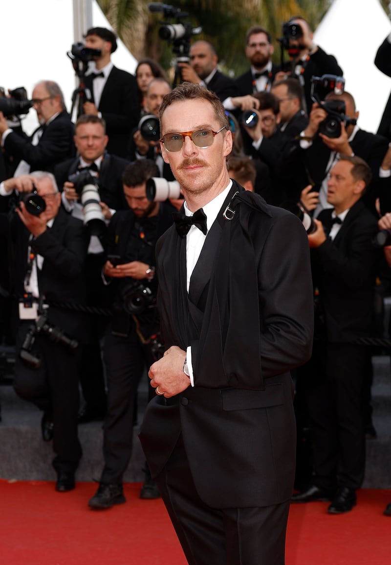 Benedict Cumberbatch wore a black silk sling with his Prada suit. Photograph: Guillaume Horcajuelo/European Pressphoto Agency
