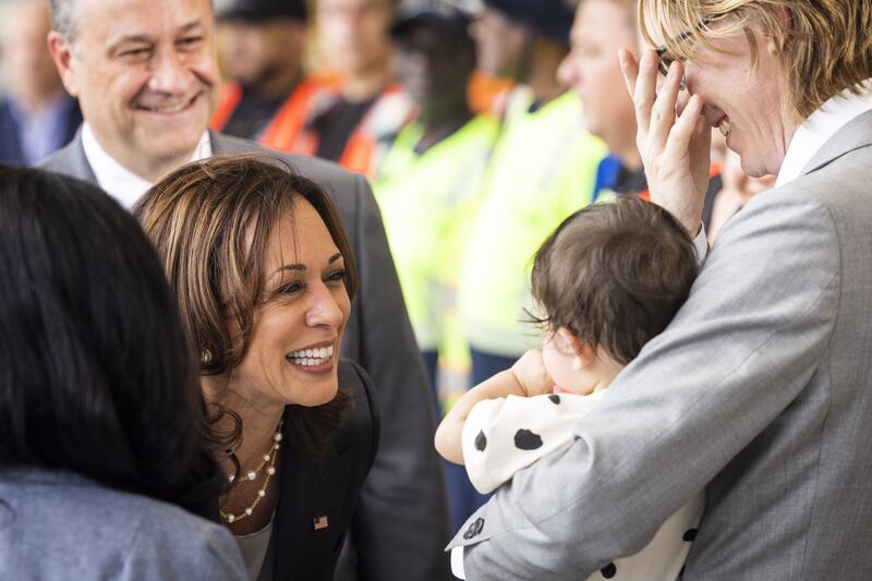 US vice-president Kamala Harris greets eight-month-old Manadana Marvel Metcalf prior to speaking about Operation Fly Formula, emergency measures to counteract the US's shortage of baby formula. 