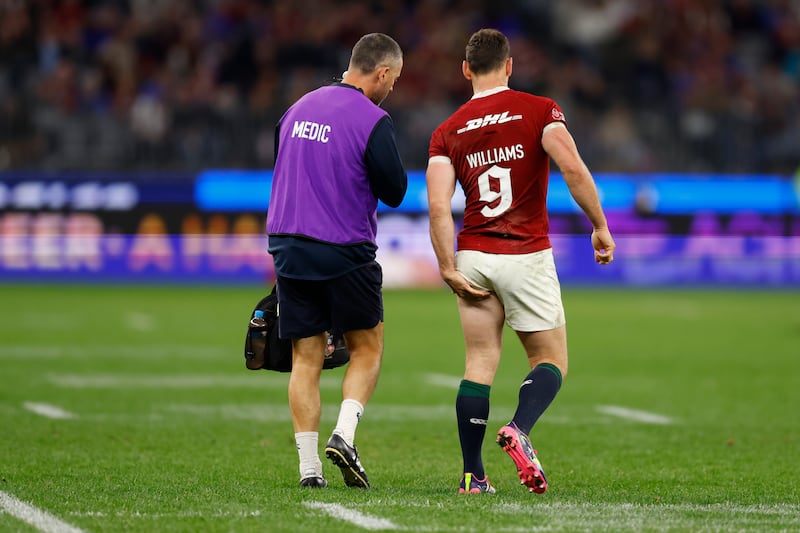 Tomos Williams clutches his left hamstring as he is replaced. Photograph: James Worsfold/Getty Images