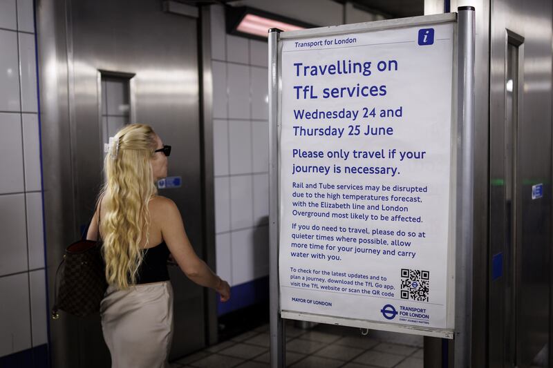 A person goes past a sign warning passengers of the possible hot weather disruptions to travel on the London Underground as the UK is set to experience its hottest June day on record. Photograph: European Pressphoto Agency