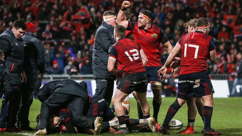 Billy Holland and Munster celebrate Simon Zebo’s second half score against Castres. Photograph: Gary Carr/Inpho