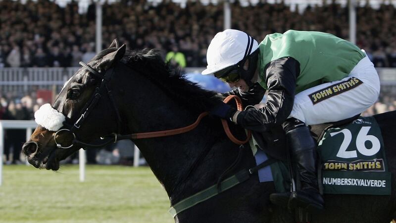 Jockey Niall Madden riding Numbersixvalverde to victory in the 2006 Grand National at Aintree. Photograph: Christopher Lee/Getty Images