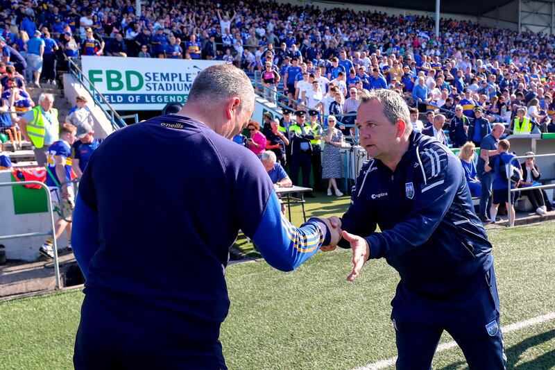 Tipperary manager Liam Cahill and Waterford manager Davy Fitzgerald shake hands after the game. Photograph: Bryan Keane/Inpho