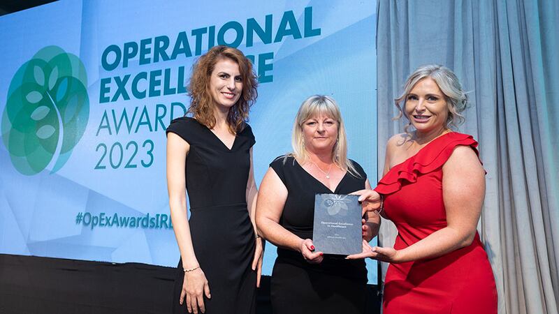 Sonia Fallon, bid manager and ESG lead at Sensori Facilities Management, presents the operational excellence in healthcare award to Angelica Puscasu and Jenny Whelan, AllView Healthcare
