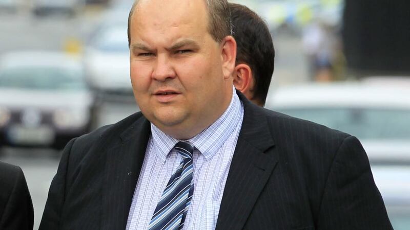 Wexford auctioneer Aidan Leacy leaving court yesterday after the opening day of a High Court action taken by Frank Brownrigg against himself and Ben Kavanagh.