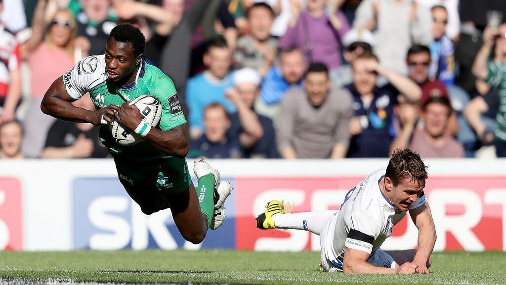 Connacht’s Niyi Adeolokun finishes off a lovely piece of skill on the right wing to beat Eoin Reddan to the try line at Murrayfield. Photograph: Dan Sheridan/Inpho