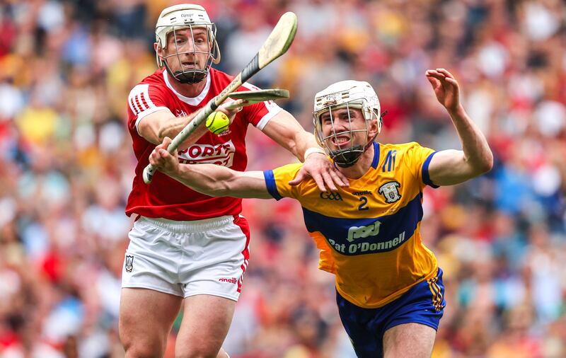 Cork's Patrick Horgan and Adam Hogan of Clare tussle for possession. Photograph: Bryan Keane/Inpho