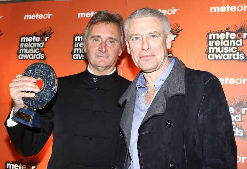 Henry Mount Charles poses with U2's Adam Clayton at the 2010 Meteor Ireland Music Awards. Photograph: Phillip Massey/WireImage