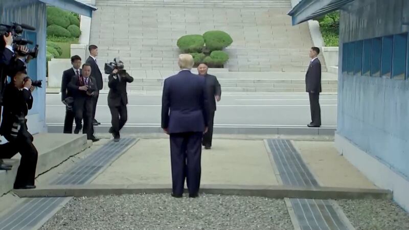 US president Donald Trump meets North Korean leader Kim Jong-un at the demilitarised zone. Image: Reuters TV