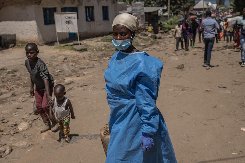 Gentille Ndangikimana helps the Red Cross search for the bodies of people after the floods in Nyamukubi, eastern Democratic Republic of Congo. Photograph: Guerchom Ndebo/AFP via Getty