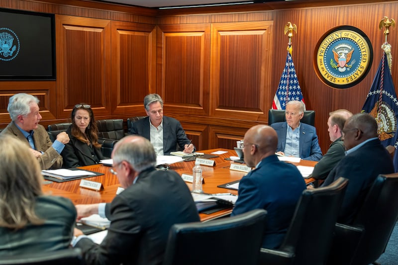 Joe Biden meets his national security team as the situation developed on Saturday night. Photograph: Adam Schultz/AP