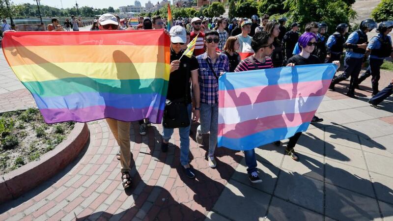 Participants carry flags during the Gay Pride parade in Kiev, Ukraine. Photograph: Roman Pilipey/EPA.