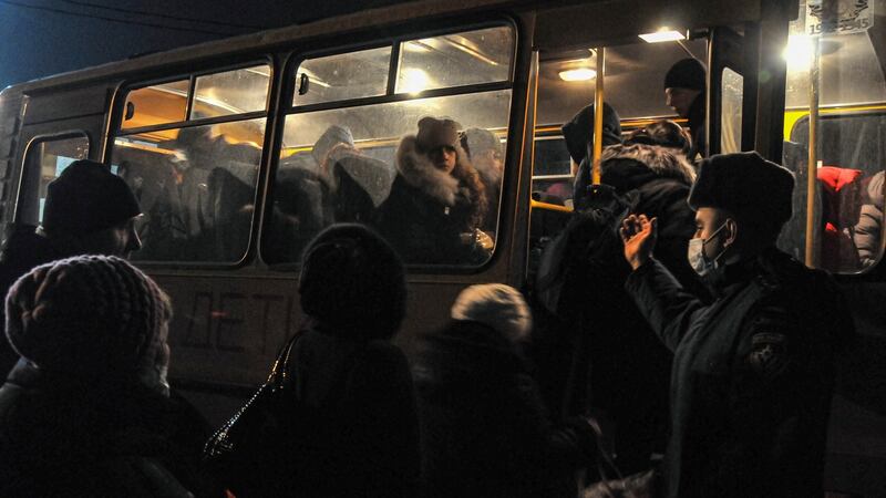 Local residents in Donetsk get into a bus to enter Russia at the customs post in the Rostov region. Photograph: Arkady Budnitsky/EPA