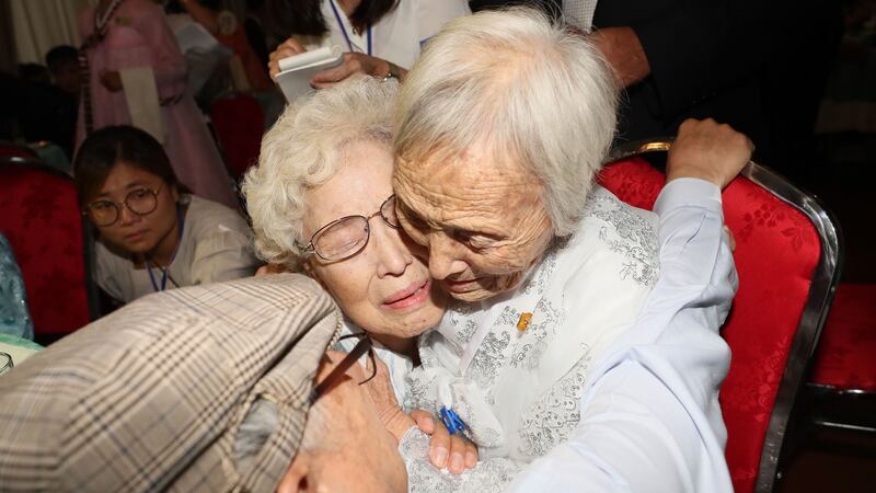 South Korean Jo Hye-do (centre, 86) hugs her North Korean sister Jo Soon-do (89) during Monday’s  inter-Korean family reunion. Photograph: Yonhap/AFP/Getty Images