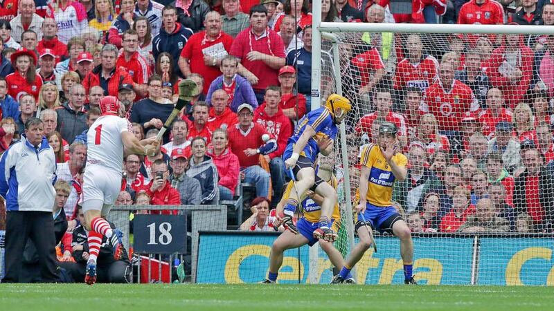 Clare goal keeper Patrick Kelly saves a free from Cork’s Anthony Nash. Photograph: Inpho
