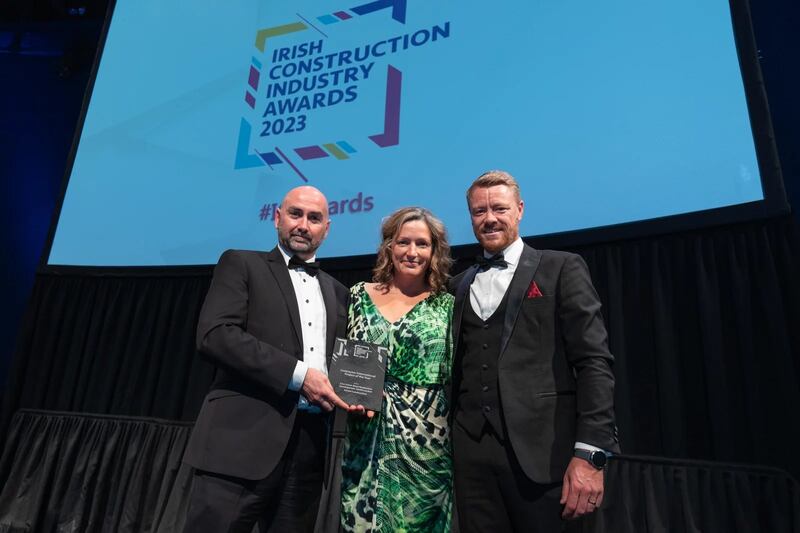 Barry Doyle, director at KSN Project Management, presents the contractor international project of the year award to Patrick Crowley and Sheila Gisler, CField Construction