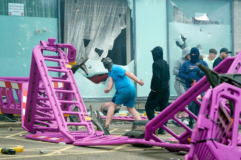 Windows are smashed as trouble flares during an anti-immigration protest outside the Holiday Inn Express in Rotherham, Yorkshire. Photograph: Danny Lawson/PA Wire