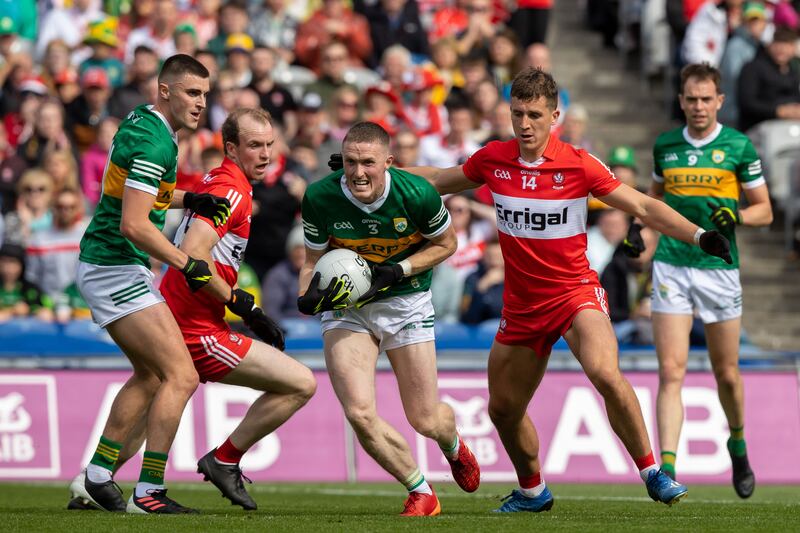 Kerry’s Jason Foley with Shane McGuigan of Derry. The Kerry full back provides a calm and imposing presence at the heart of the defence. Photograph: Morgan Treacy/Inpho 