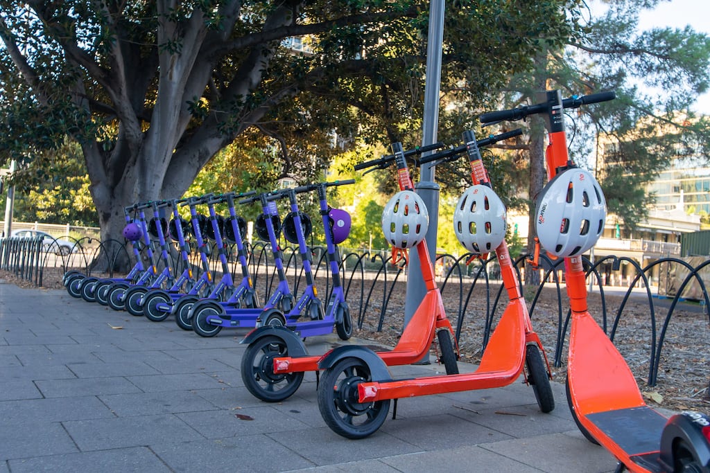 E-scooters in Canberra are connected to an app so they automatically cap your speed depending on where you are in the city. Photograph: William Ho