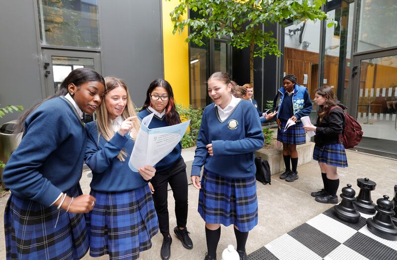 Ketsia Nganga, Lara Mason, Chalisa Clarke, and Noemi Singeorzan students from Kishogue Community College in Lucan, chat to each other about their Leaving Certificate exam papers. Photograph: Alan Betson
