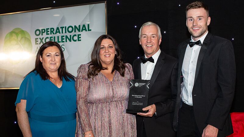 Brian Coll, Judging Co-ordinator, presents the Operational Excellence in Education award to Careers Service and Disability Support Service, MTU team.