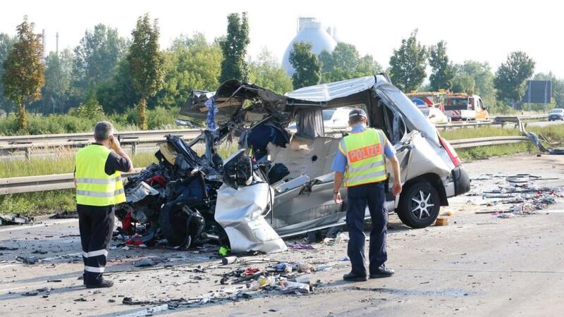 German policemen investigate at the site of a coach crash on the A4 motorway near Dresden-Neustadtin Germany today. At least nine people were killed and 43 injured in a multiple bus crash. Photograph: Rico Loeb/EPA.