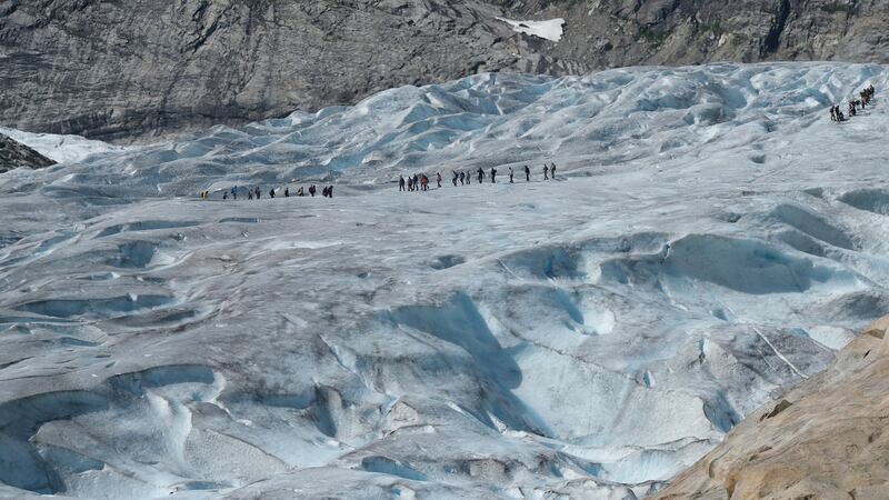 Visitors on a guided tour walk on the melting Nigard glacier (Nigardsbreen)  on August 10th, 2020, near Gaupne, Norway. Photograph: Sean Gallup/Getty
