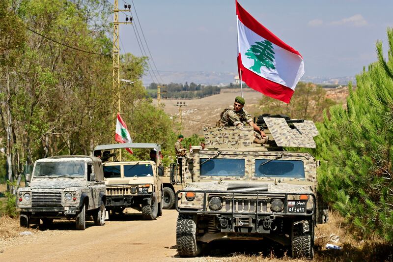 Soldiers of the Lebanese army enter Zawtar al-Gharbiya, Lebanon, on Tuesday. Lebanon deployed troops to take control of so-called 'pilot zones' in southern Lebanon from which Israeli troops are to withdraw. Photograph: Ali-Hashisho/EPA