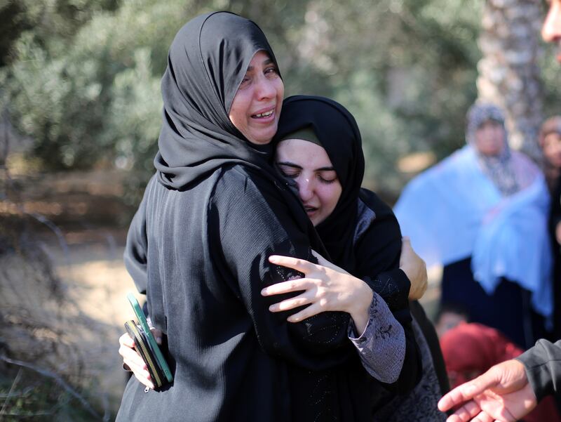 Mourners grieve over the bodies of people killed in an Israeli airstrike in Khan Younis, in southern Gaza, on Friday, October 13th. Photograph: Yousef Masoud/The New York Times