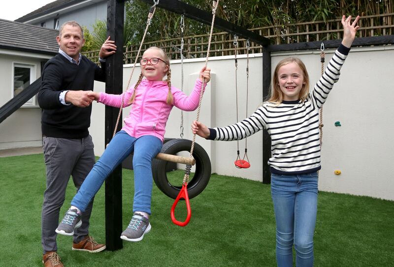 Noel Kelly with his daughters Elena (7) and Lauren (9) at their home in Tuam, Co Galway. Photograph: Joe O’Shaughnessy
