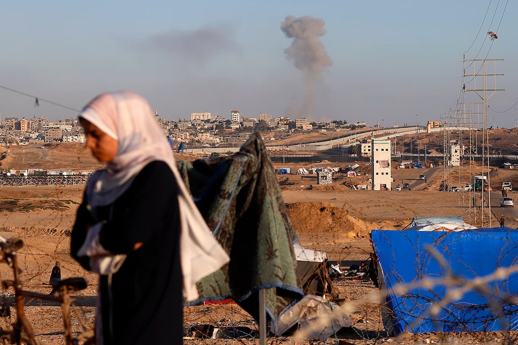 Smoke rises following an Israeli airstrike on buildings near the separating wall between Egypt and Rafah, southern Gaza on Monday, Photograph: Ramez Habboub/AP