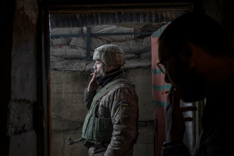 A Ukrainian soldiers smokes a cigarette as a battle against Russian troops continues in the vicinity of Bakhmut, eastern Ukraine. Photograph: Mauricio Lima/New York Times