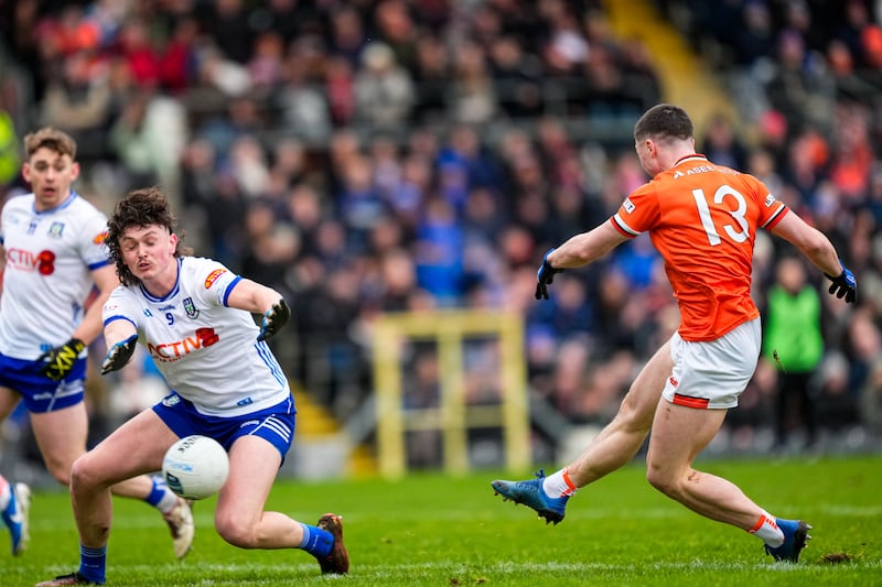 Oisín Conaty of Armagh fires a shot at goal while Monaghan's Gary Mohan attempts to block it. Photograph: Inpho
Mandatory Credit ©INPHO/James Lawlor 