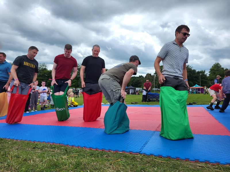 Dads taking part in the sack race 