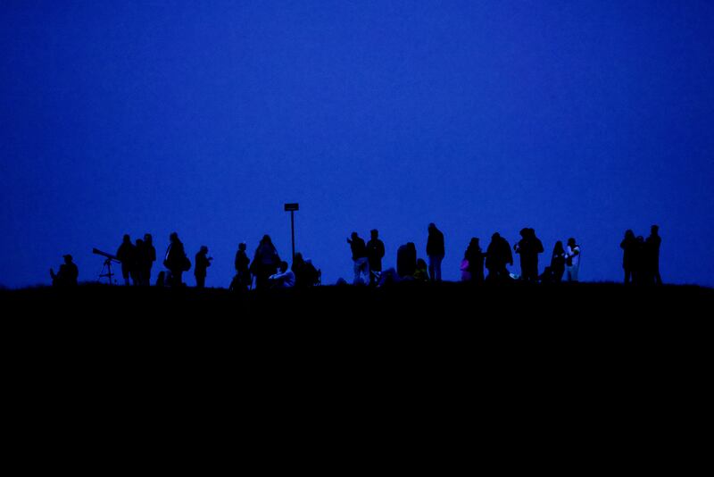 People wait for the sun to rise at the Hill of Tara. Photograph: Alan Betson/The Irish Times

