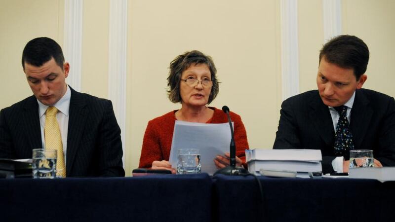Geraldine Finucane (centre) and her two sons Michael (right) and John hold a press conference in Westminster after hearing the de Silva report in 2012. Photograph: Stefan Rousseau/PA Wire